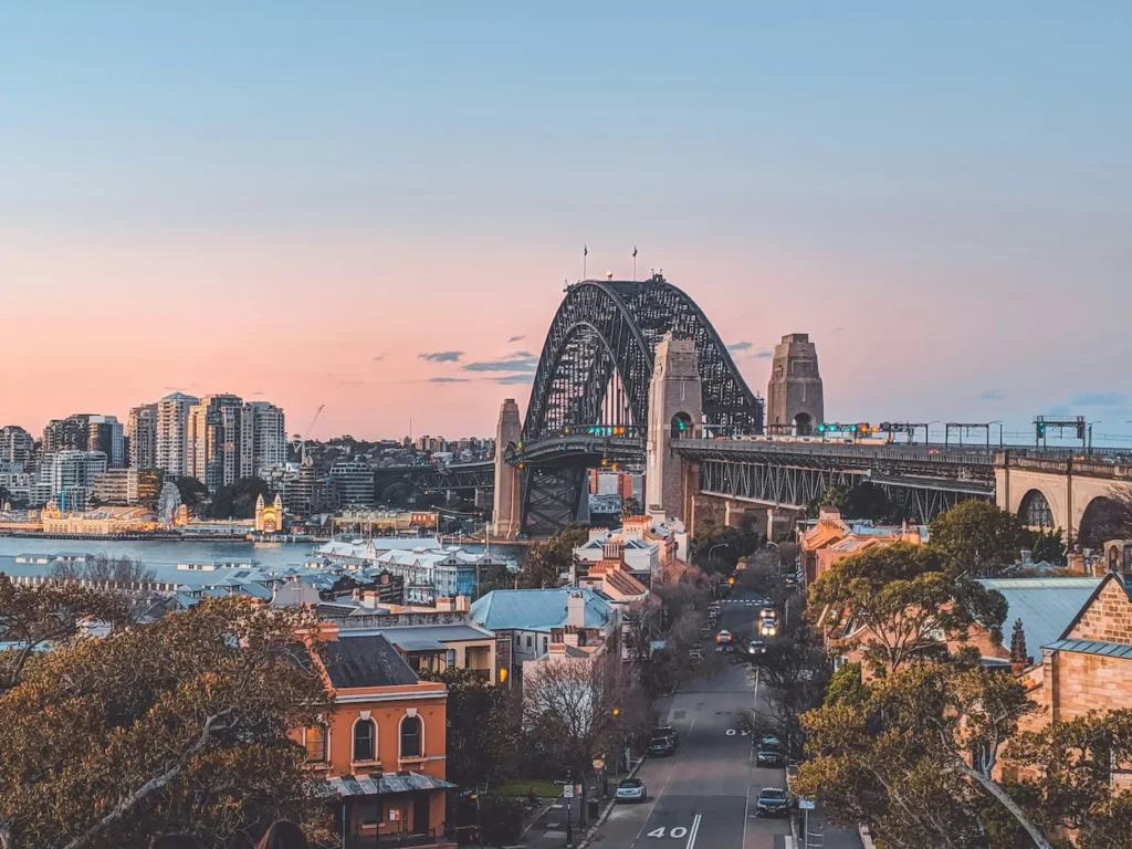 Sydney Harbour Bridge and the Rocks neighborhood street during a soft pink sunset