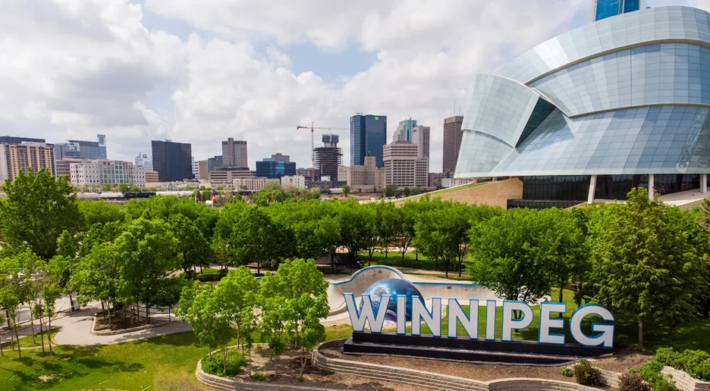 Large outdoor Winnipeg sign with curved glass Canadian Museum for Human Rights building