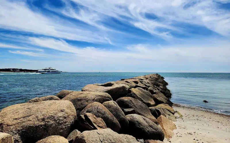 Rocky jetty stretching into the sea at Kalmus Beach.