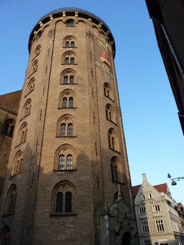 The Round Tower in Copenhagen with its tall brick façade and arched windows.