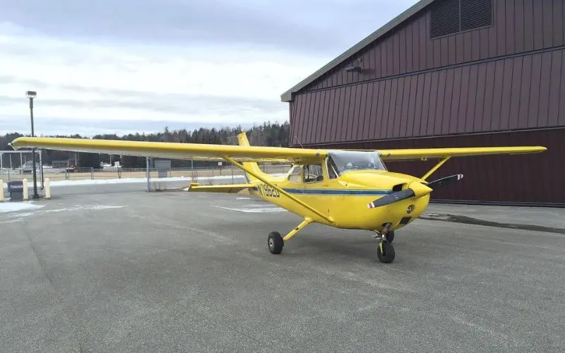 Small yellow airplane at Adirondack Flying Service.