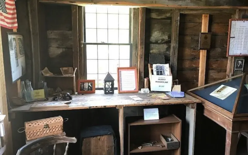 Wooden desk and artifacts inside Barnstable Old Gaol.