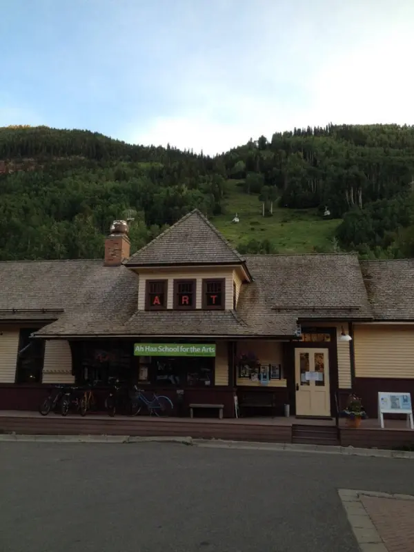 The Ah Haa School for the Arts building with a mountain backdrop.