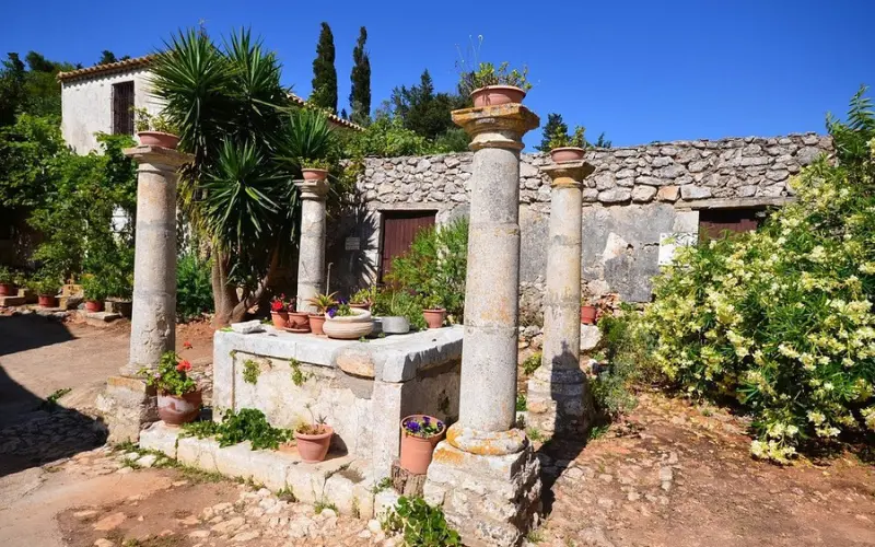 Stone columns and courtyard at Anafonitria Monastery.
