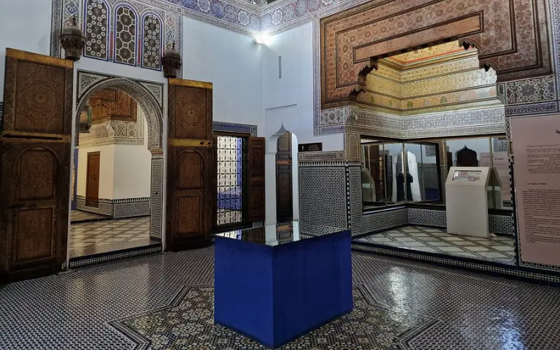 Ornate tiled interior with arches at Dar Si Said Museum in Marrakech.