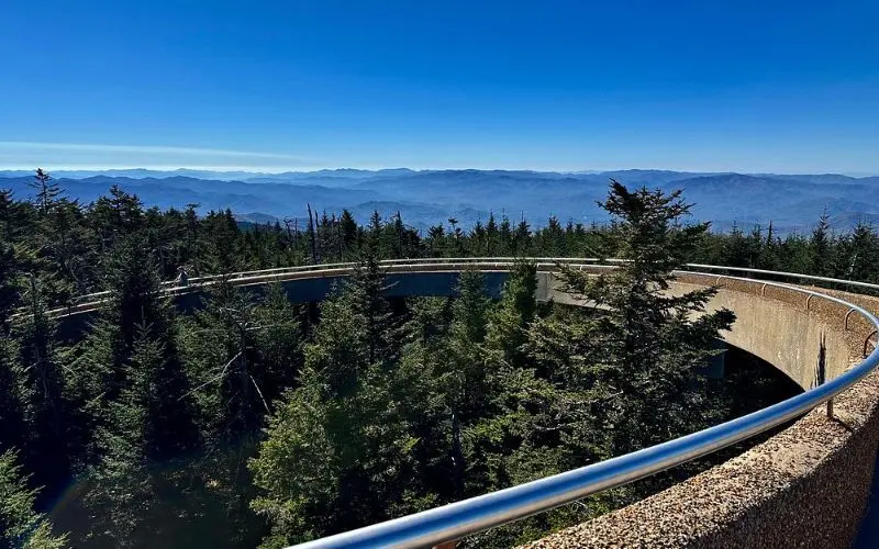 Elevated walkway overlooking forest and mountains at Clingmans Dome.