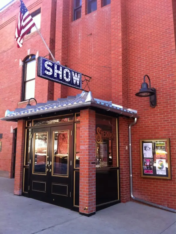 The entrance of the historic Sheridan Opera House with a “SHOW” sign.