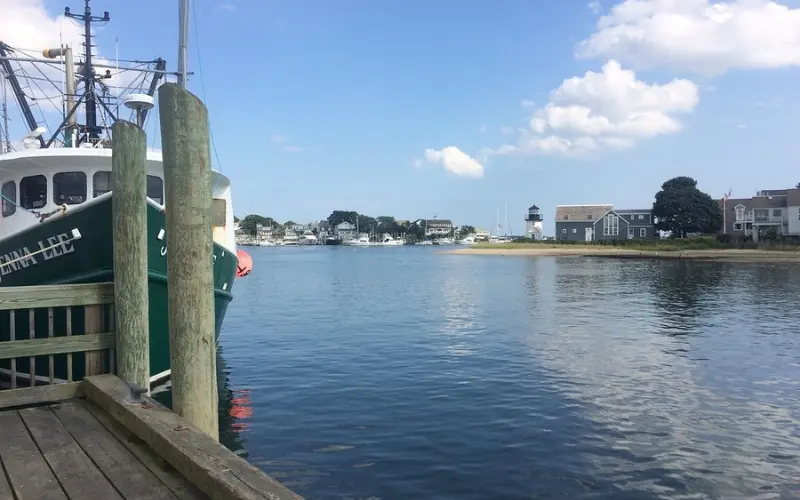 Fishing boat and waterfront view at Hyannis Harbor.