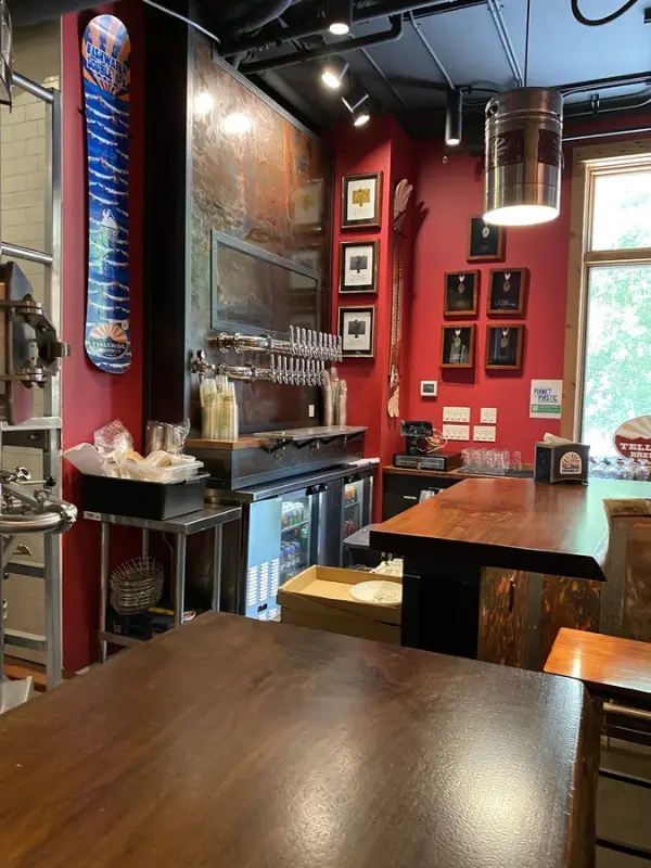 Inside Telluride Brewing Company with taps and rustic decor.