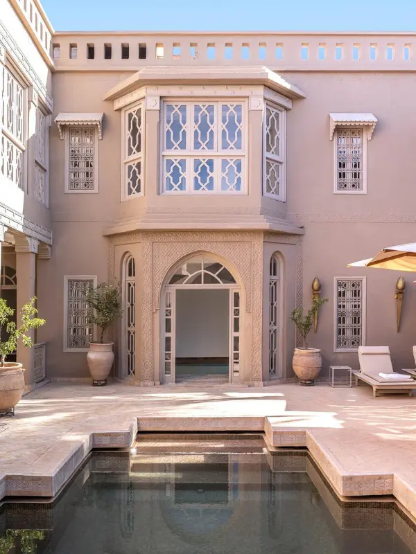 Courtyard with pool and traditional architecture at a hammam in Marrakech.
