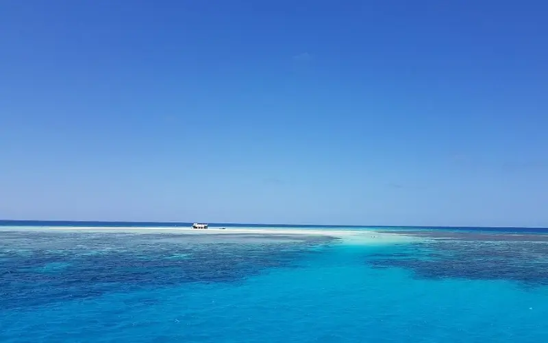 Clear turquoise waters over coral reefs at Tubbataha Reefs Natural Park.