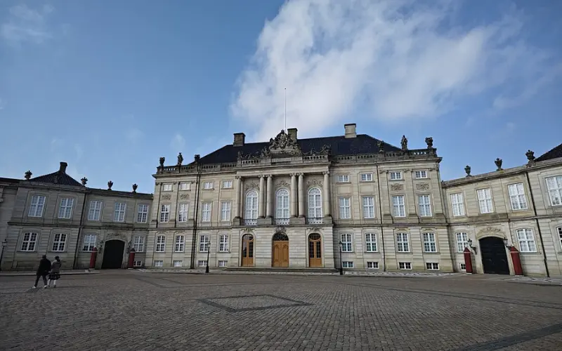 The grand exterior of Amalienborg Palace in Copenhagen.