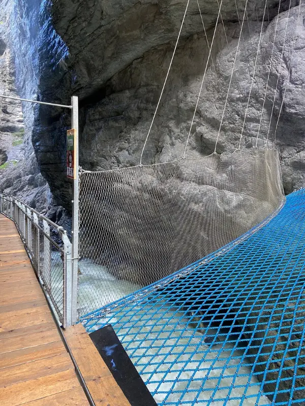 The Gletscherschlucht walkway crosses rushing water between steep rock walls.