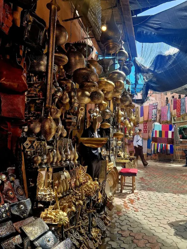 Colorful lanterns, leather goods, and textiles for sale in the souks of Marrakech.