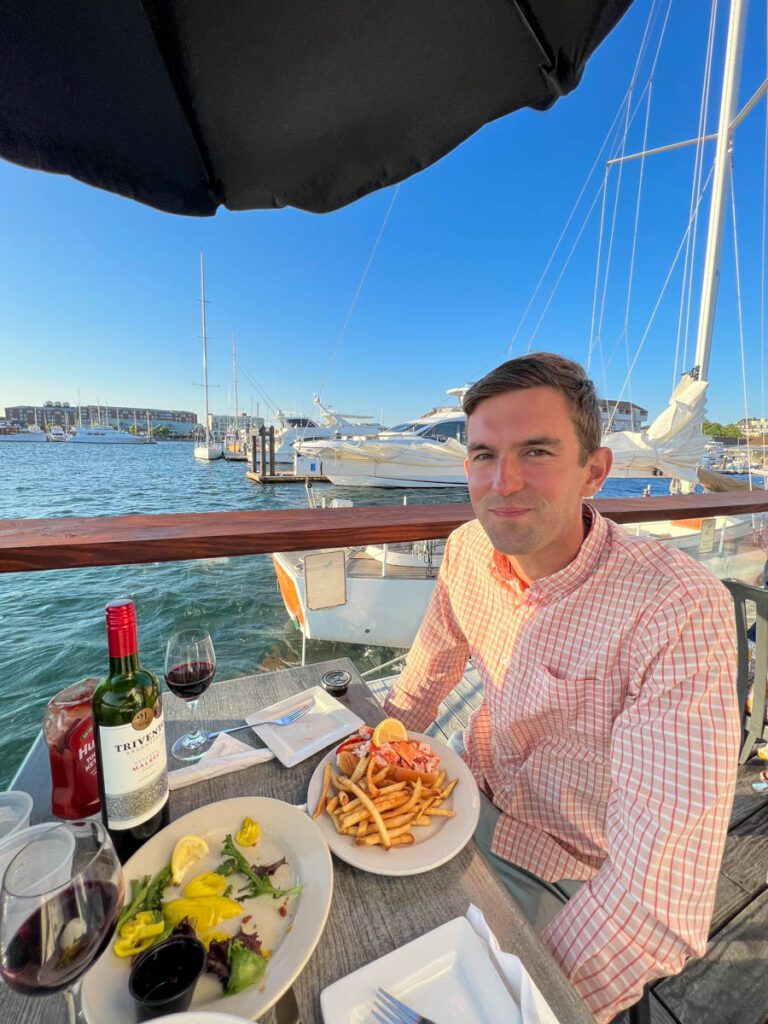 My photo of me eating a lobster roll at The Lobster Bar in Rhode Island