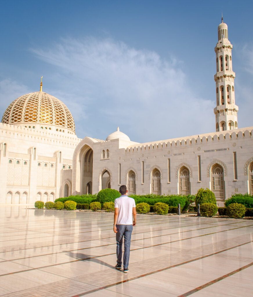 Me walking in the Sultan Qaboos Grand Mosque