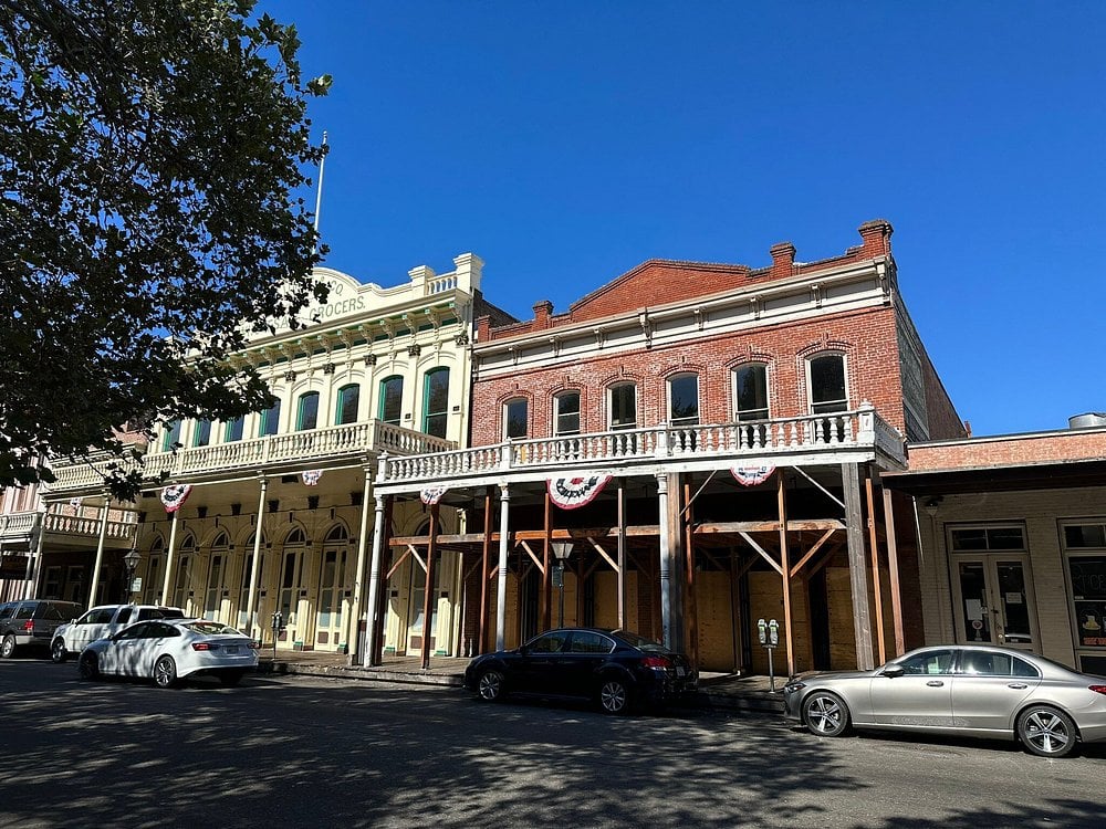 Historic brick and wooden buildings along the street in Old Sacramento.