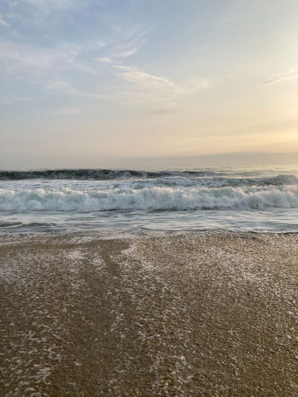 Bask in the golden hues of a Puerto Angel Beach sunset, where the sky meets the sea in perfect harmony