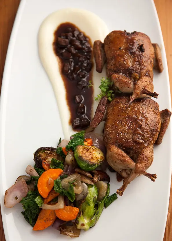Lockhart Quail stuffed with spicy Cajun dirty rice