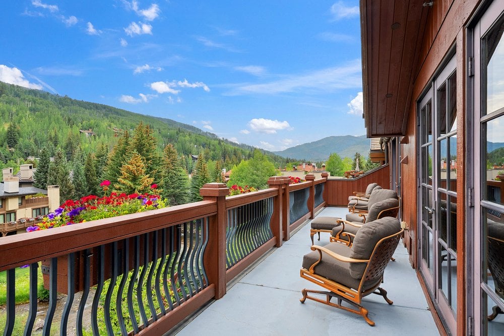 Balcony view from Sonnenalp Vail with mountain scenery and outdoor seating.