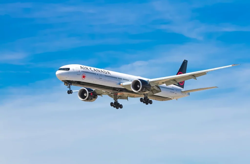 Air Canada Boeing 777 widebody passenger jet descending for landing with landing gear extended