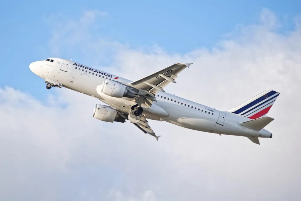 An Air France Airbus A320 domestic commercial passenger airplane climbing steeply