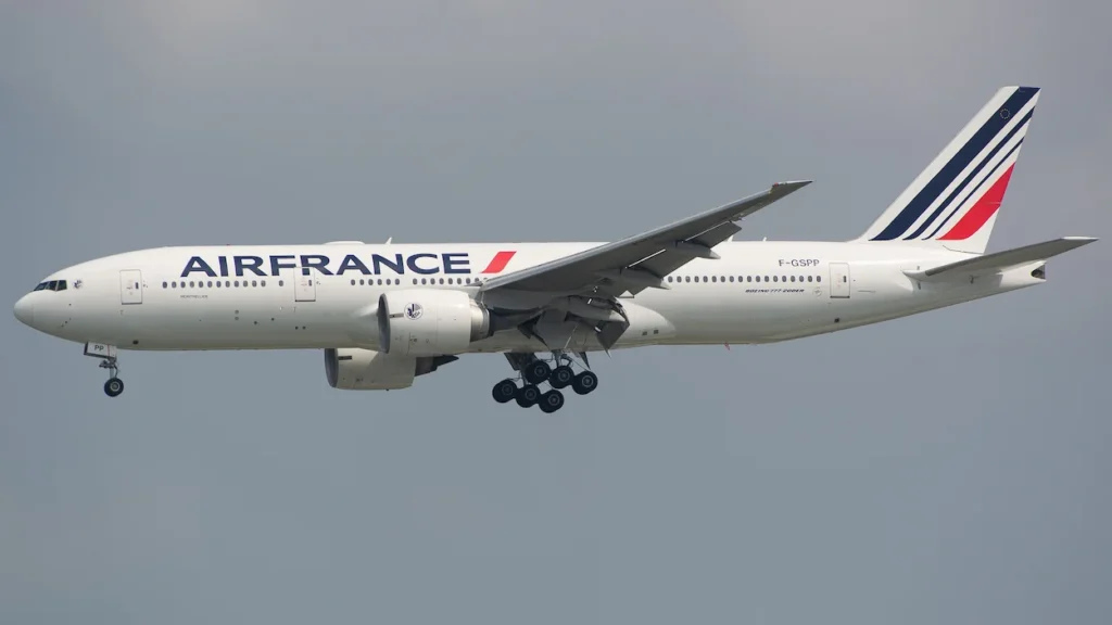 Air France Boeing 777 commercial airliner descending for touchdown with landing gear down