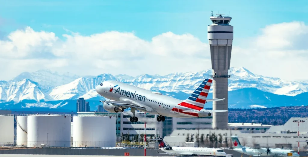 An American Airlines Airbus A321 climbing during takeoff from Calgary Airport
