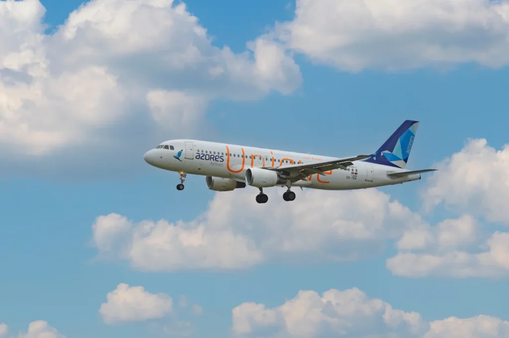 Azores Airlines Airbus A320 commercial airplane flying in a blue sky