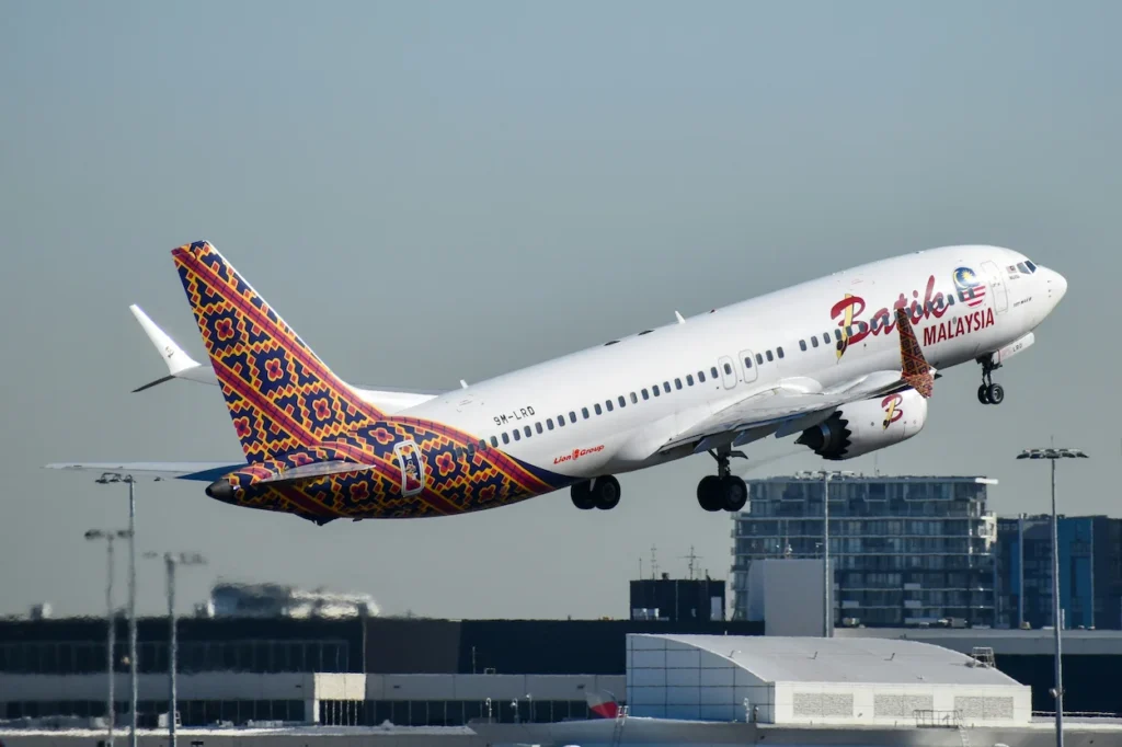 A Batik Air Malaysia Boeing 737 MAX 8 with a colorful batik tail taking off