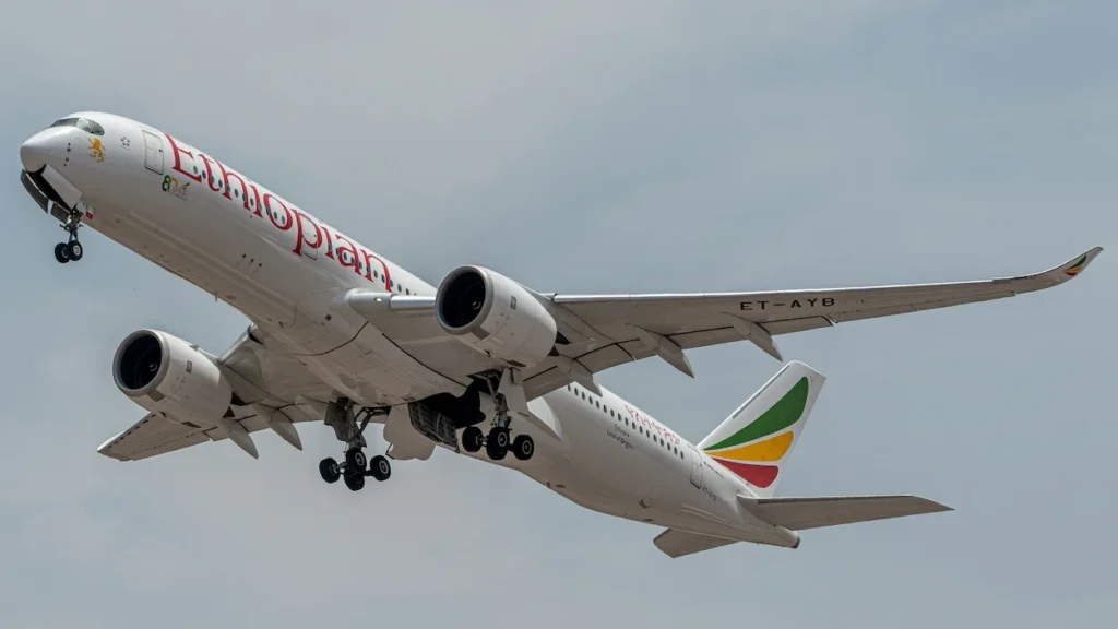 Ethiopian Airlines Airbus A350 passenger jet climbing into the sky during takeoff