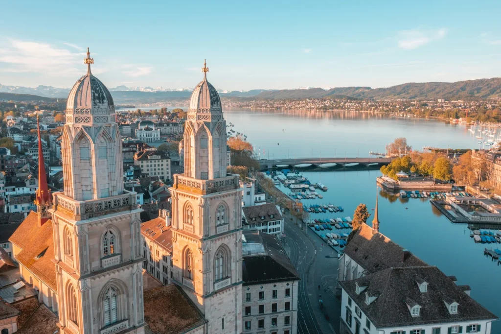 Grossmünster church towers overlooking Lake Zurich and the city skyline
