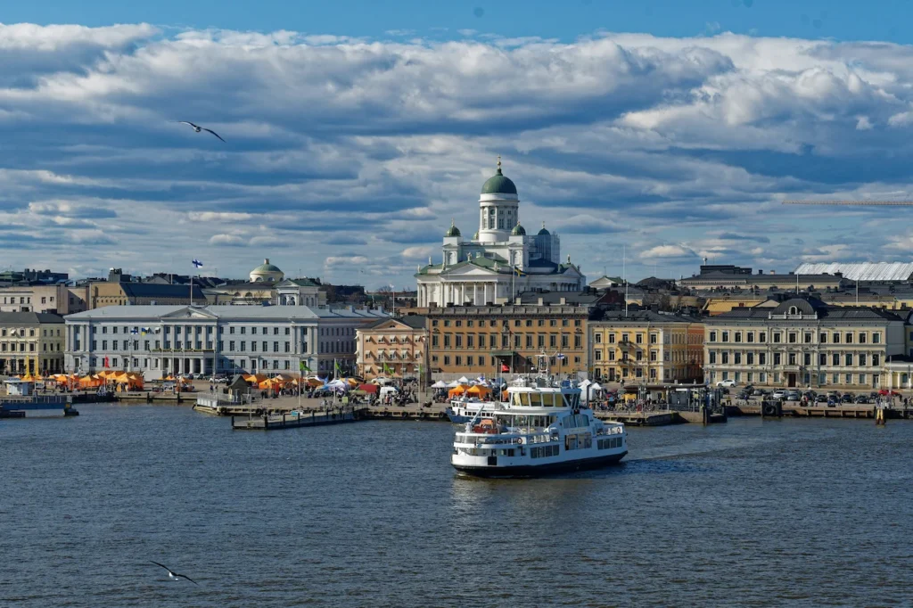 Helsinki Cathedral overlooking Market Square and a passenger ferry on the water