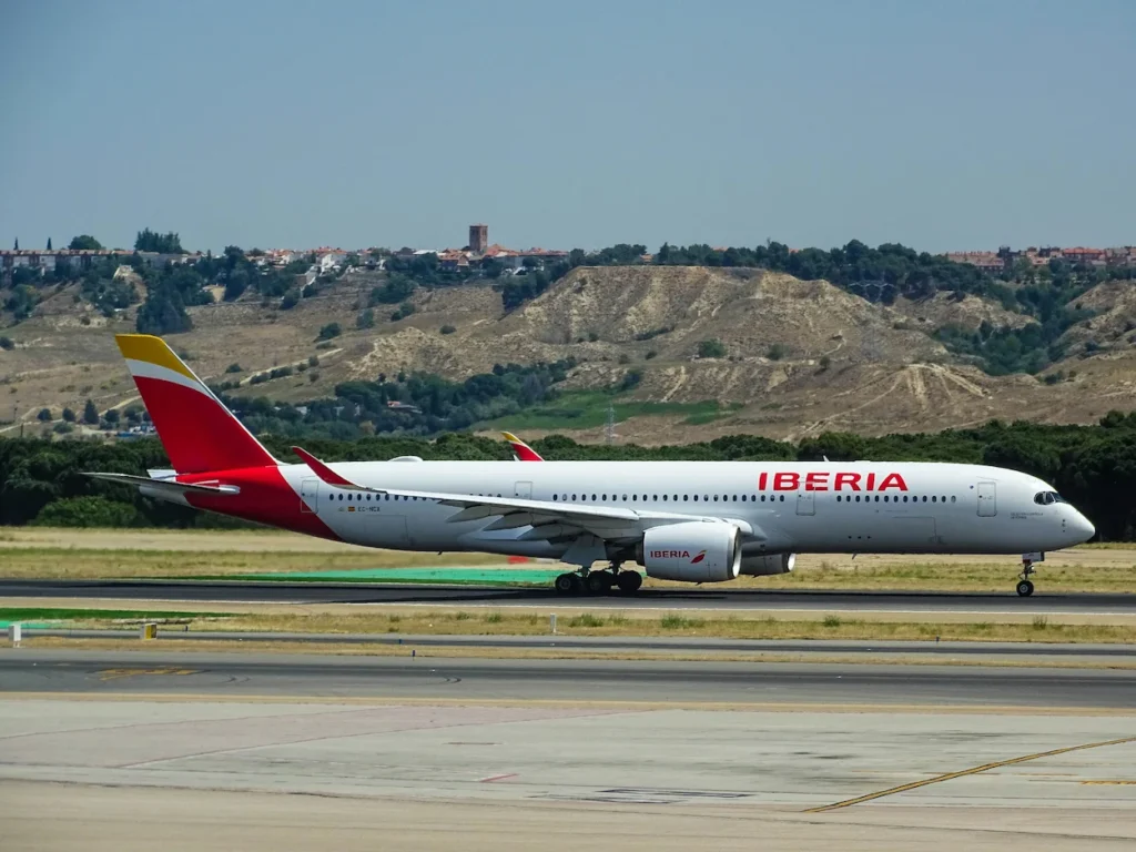 Iberia Airbus A350-900 widebody passenger airplane taxiing on an airport runway