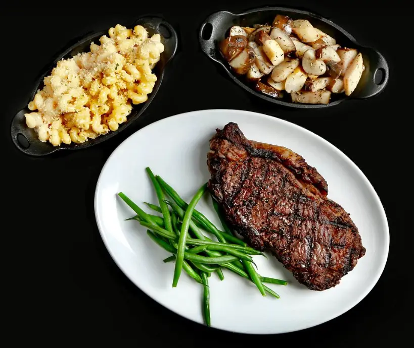 House of Cards New York Strip, paired with Three Cheese Macaroni and Duck Fat Roasted Rosemary Fingerlings