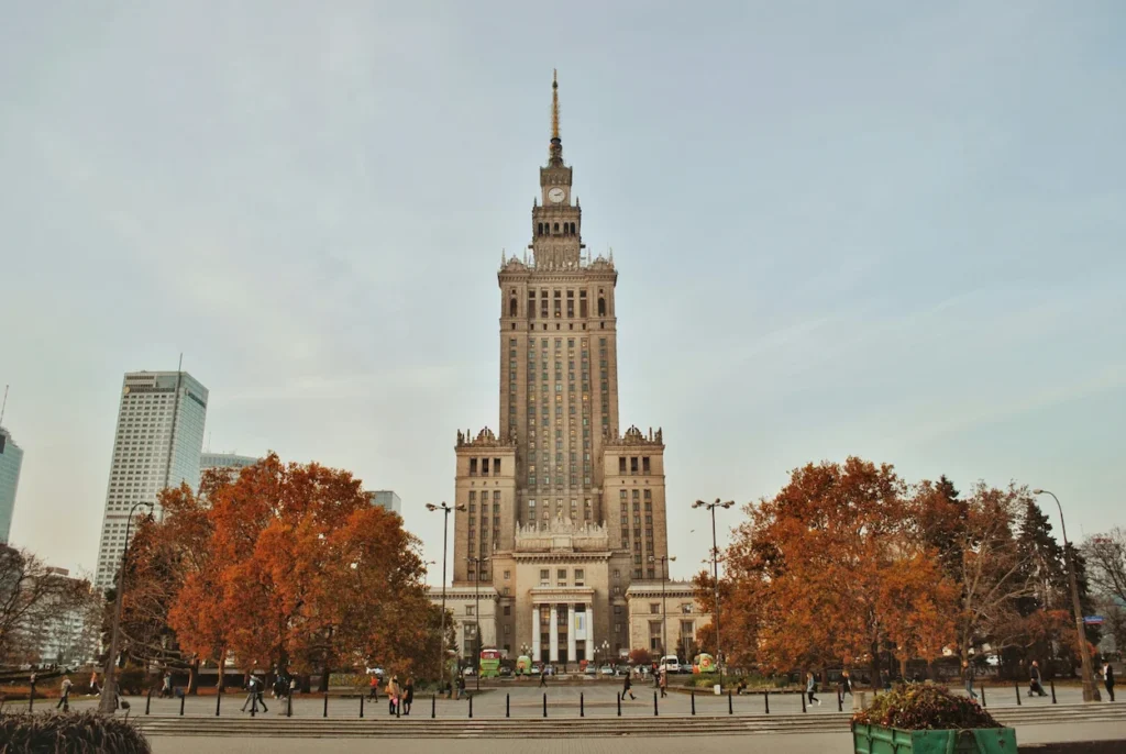 Palace of Culture and Science building in Warsaw framed by autumn trees