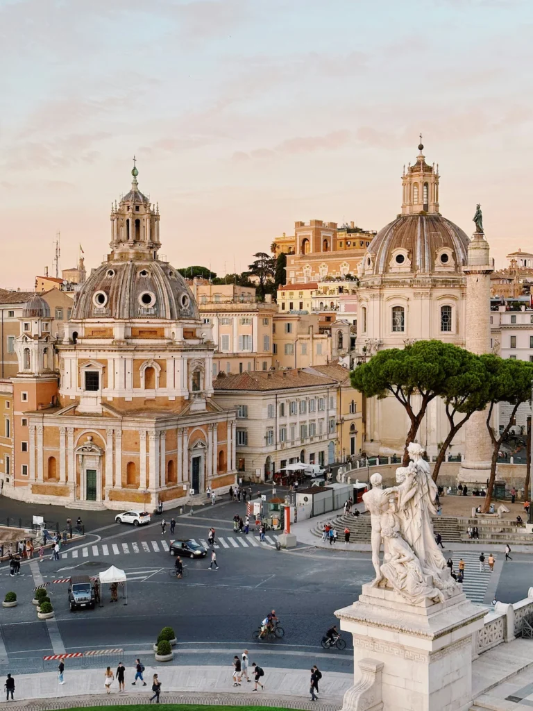 Piazza Venezia view in Rome featuring the domes of Santa Maria di Loreto and Trajan's Column