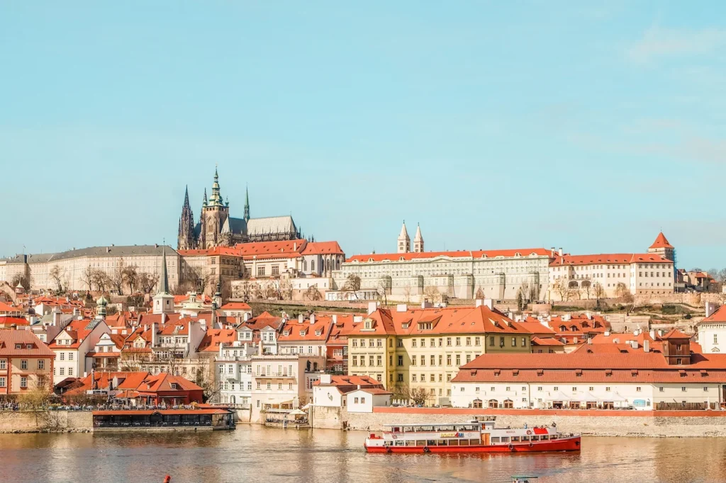Prague Castle and St. Vitus Cathedral overlooking the Vltava River and red roofs