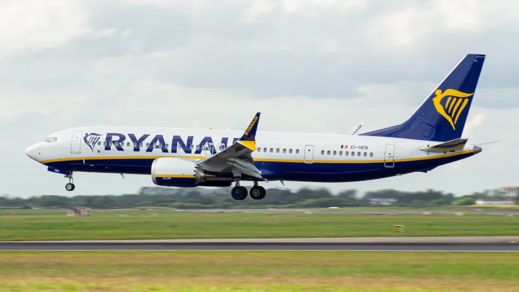 Ryanair Boeing 737 MAX commercial airplane landing on an airport runway