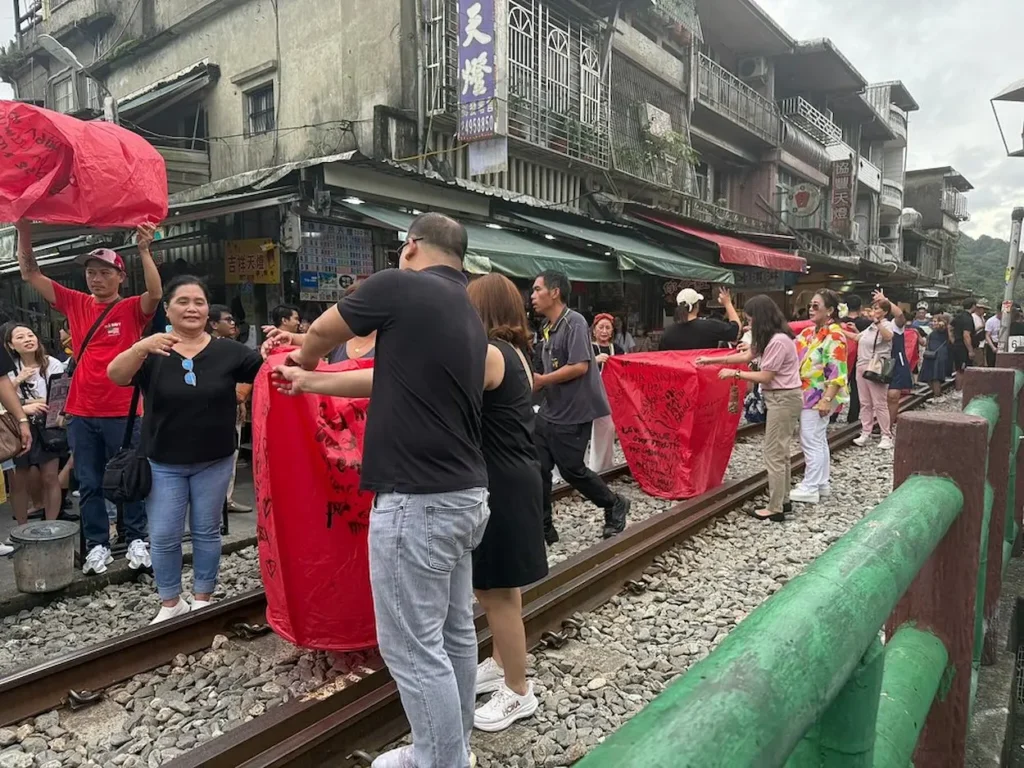 Releasing sky lanterns over the Pingxi railway