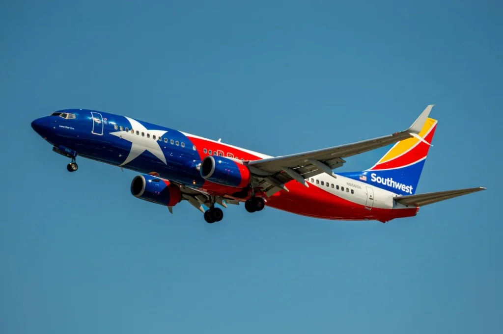 Southwest Airlines Lone Star One Texas livery Boeing 737 aircraft climbing after takeoff