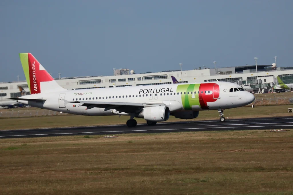 A TAP Air Portugal Airbus A320 taxiing on a runway
