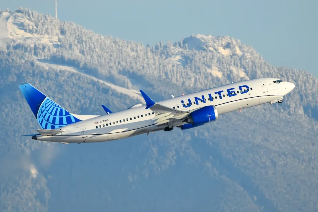 A United Airlines Boeing 737 MAX 8 passenger jet, registration N17315, climbs into the sky during takeoff