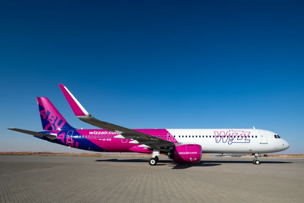 Wizz Air Abu Dhabi Airbus A321neo passenger airplane parked stationary on an airport tarmac
