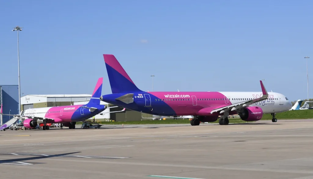 Airbus A321neo passenger airplanes parked stationary on an airport tarmac runway