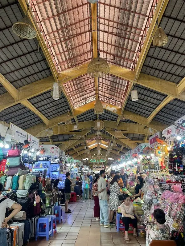 Stalls and shoppers inside Bến Thành Market in Ho Chi Minh City.