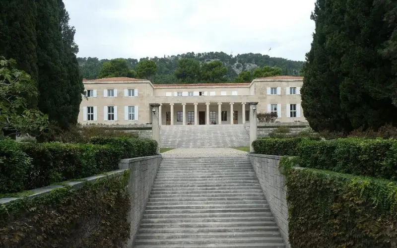 Front view of the Mestrovic Gallery with steps leading up to the entrance.