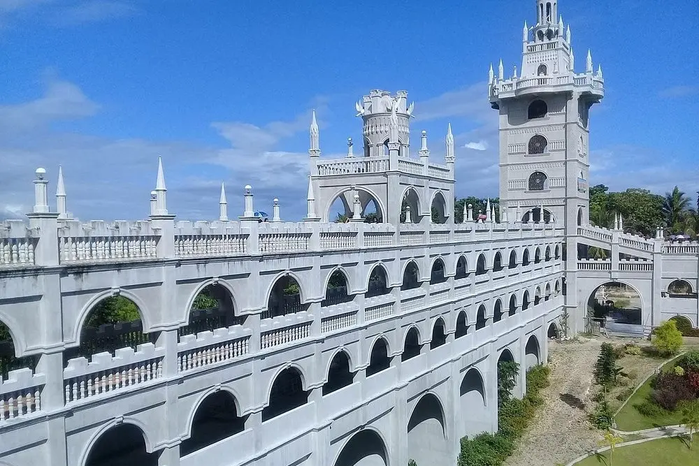 The grand white Simala Shrine with castle-like towers.