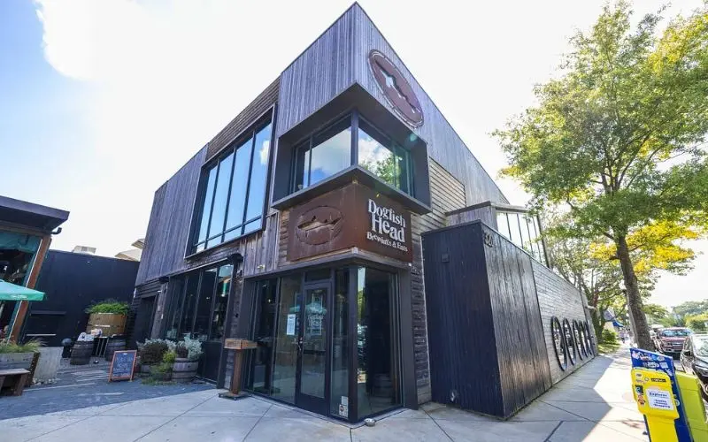 Exterior of Dogfish Head Brewings & Eats building with modern wood design.