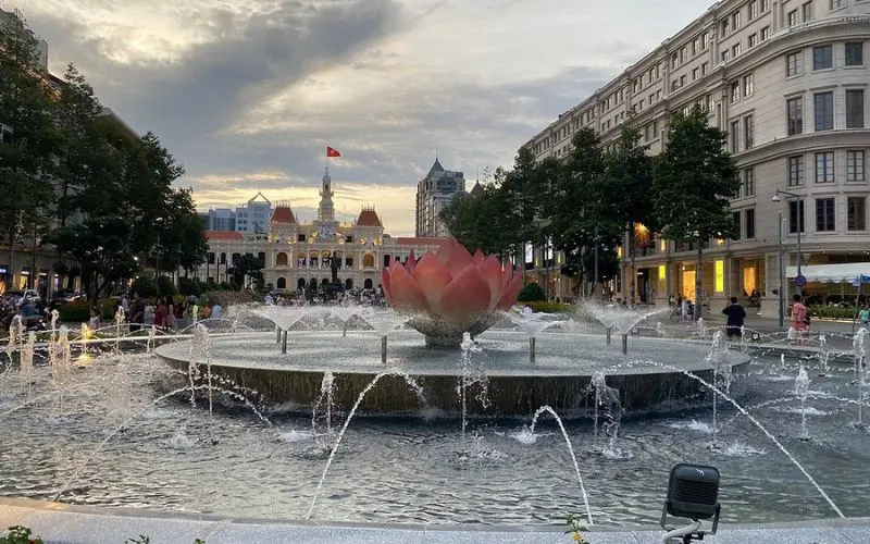 Fountain and city view in front of the Saigon Opera House.